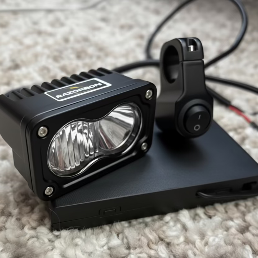 Black LED light bar on a carpeted floor