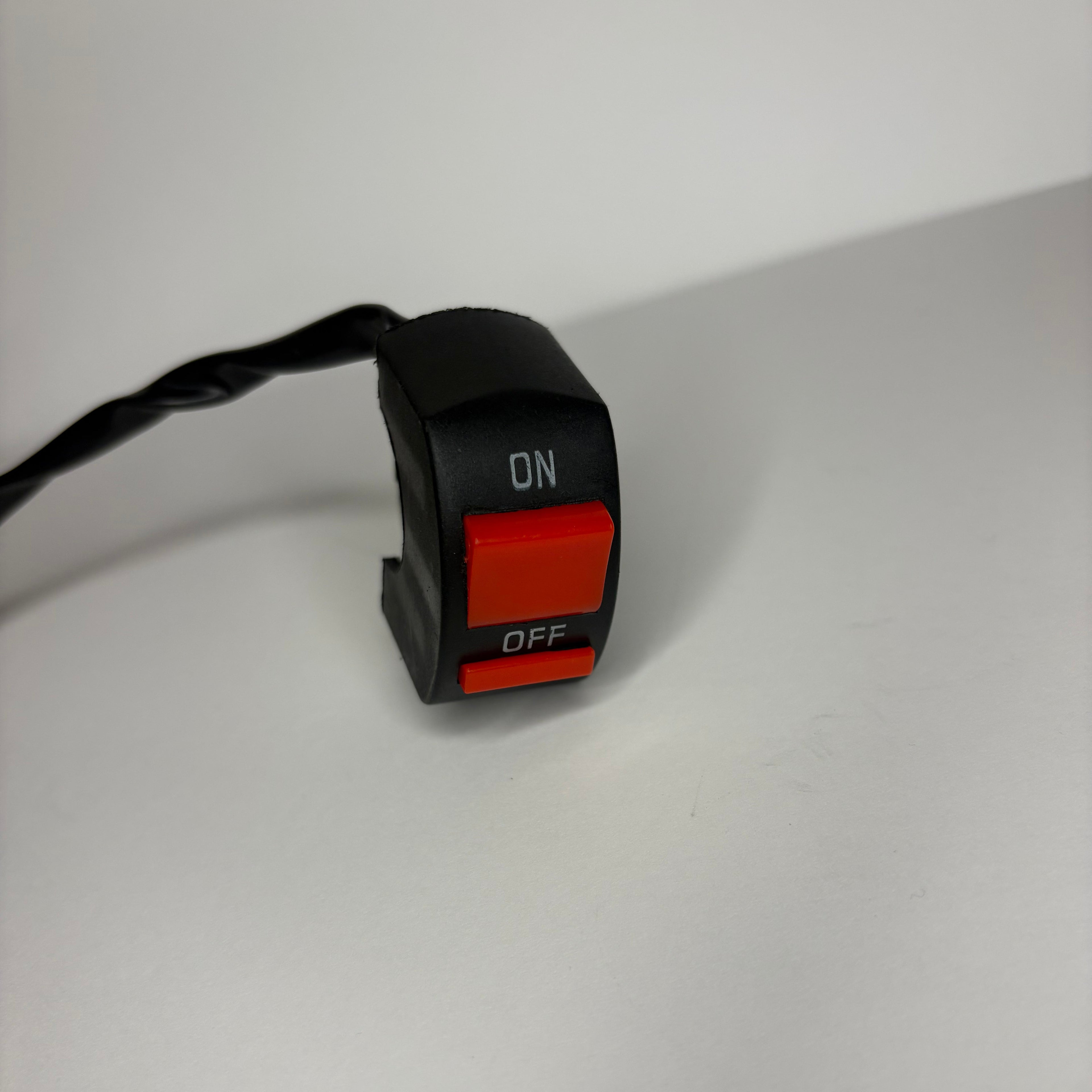 Toggle switch with red 'On' and black 'Off' buttons on a white background
