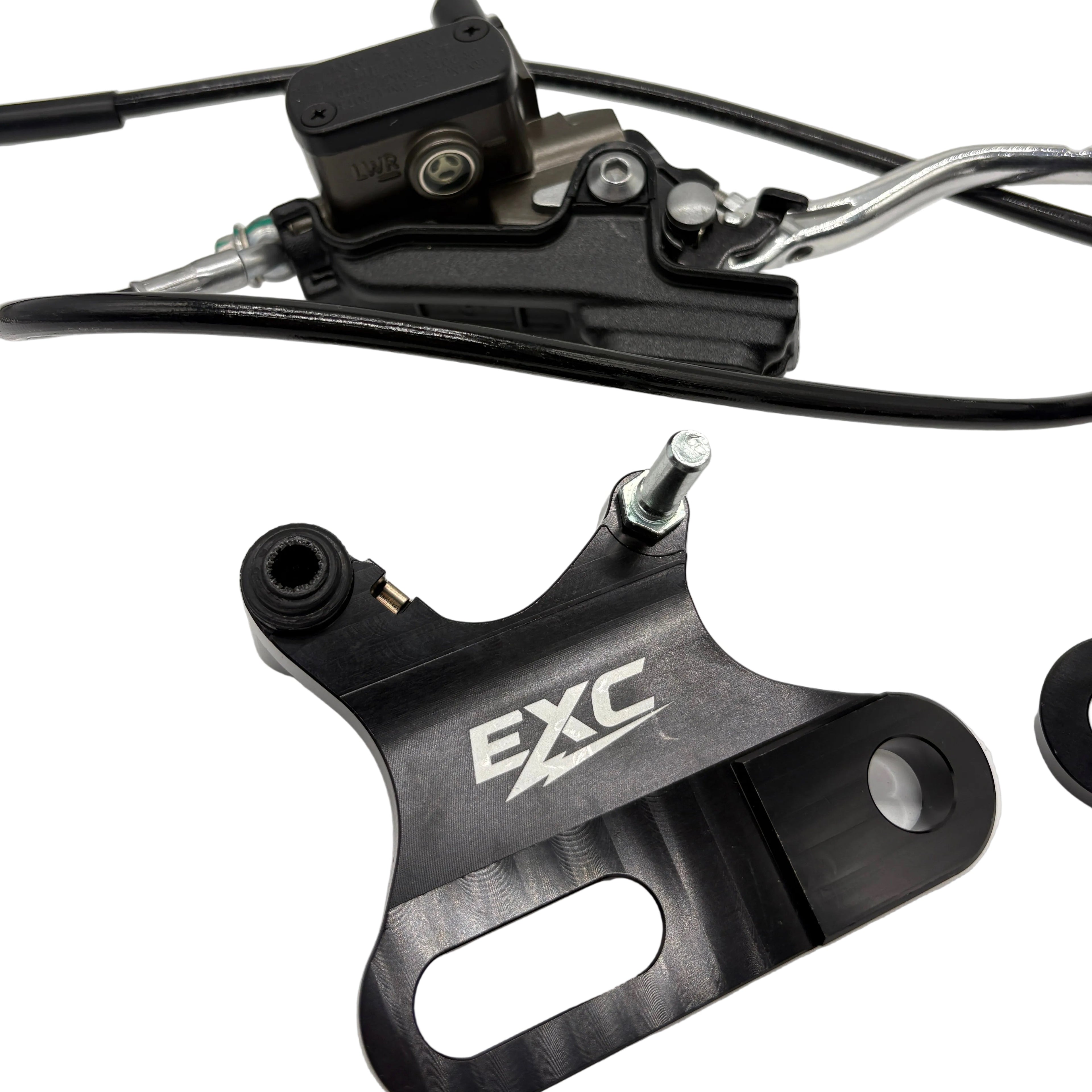 Close-up of a bicycle brake lever with 'EXC' branding on a white background