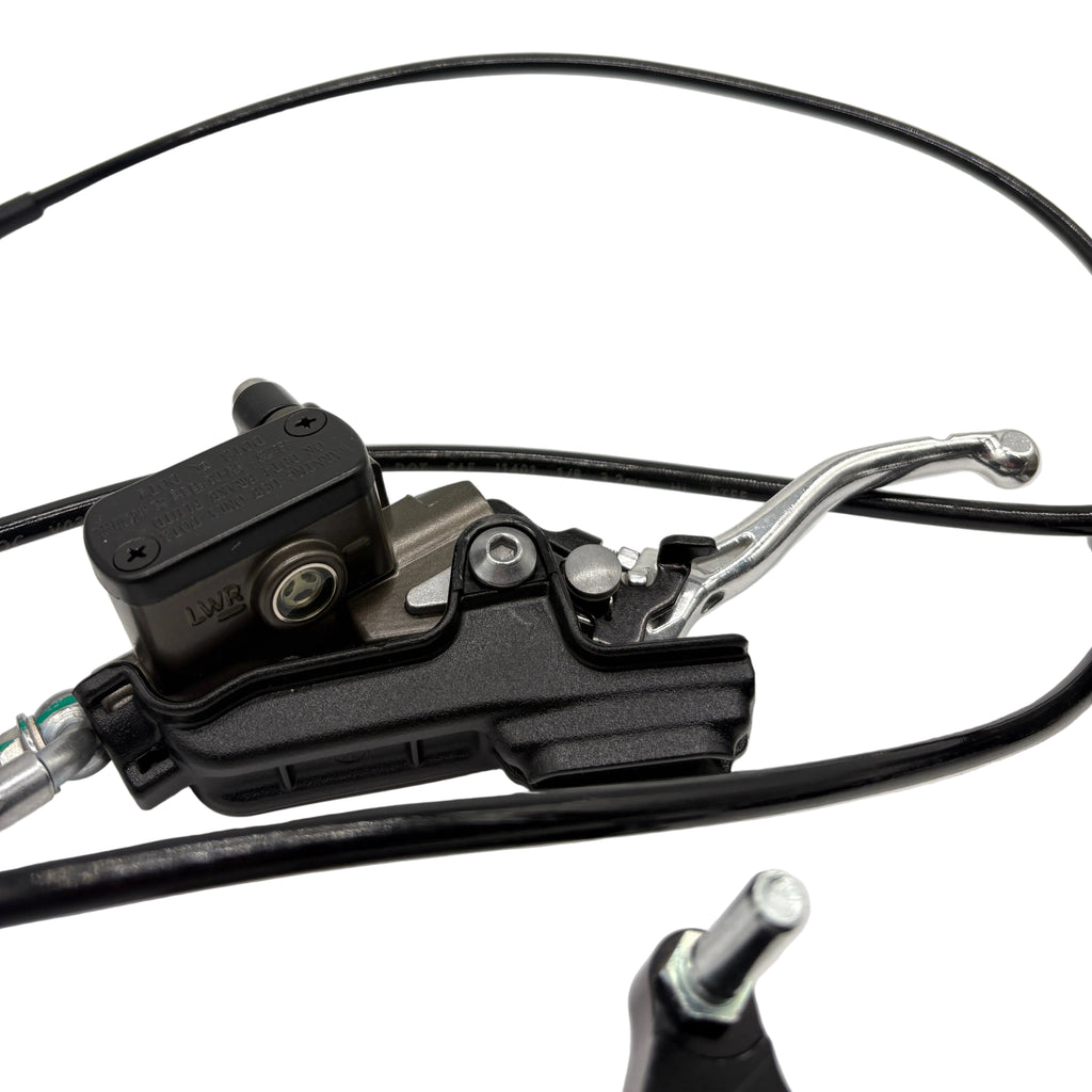 Close-up of a motorcycle brake lever and caliper on a light gray background
