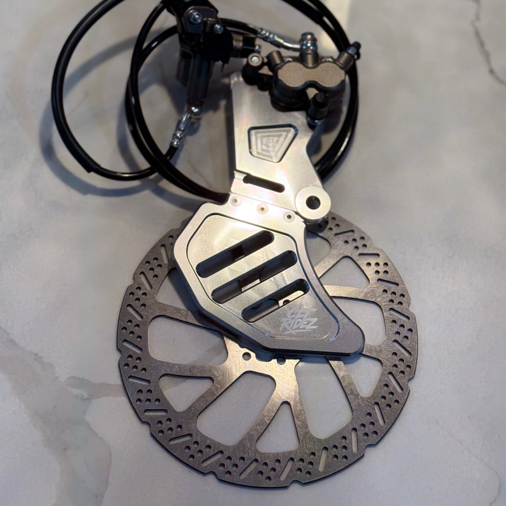 Bicycle disc brake assembly on a gray surface