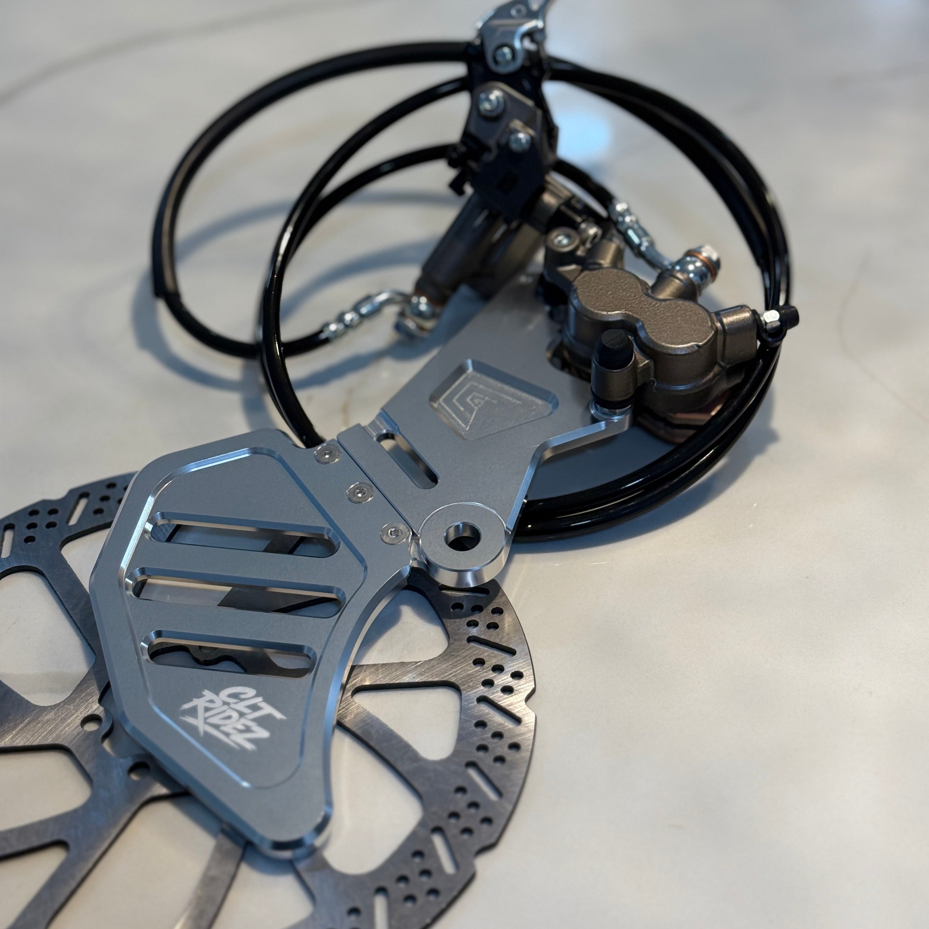 Bicycle disc brake assembly on a reflective surface