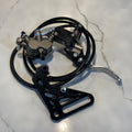 Motorcycle brake lever and caliper assembly on a marble surface