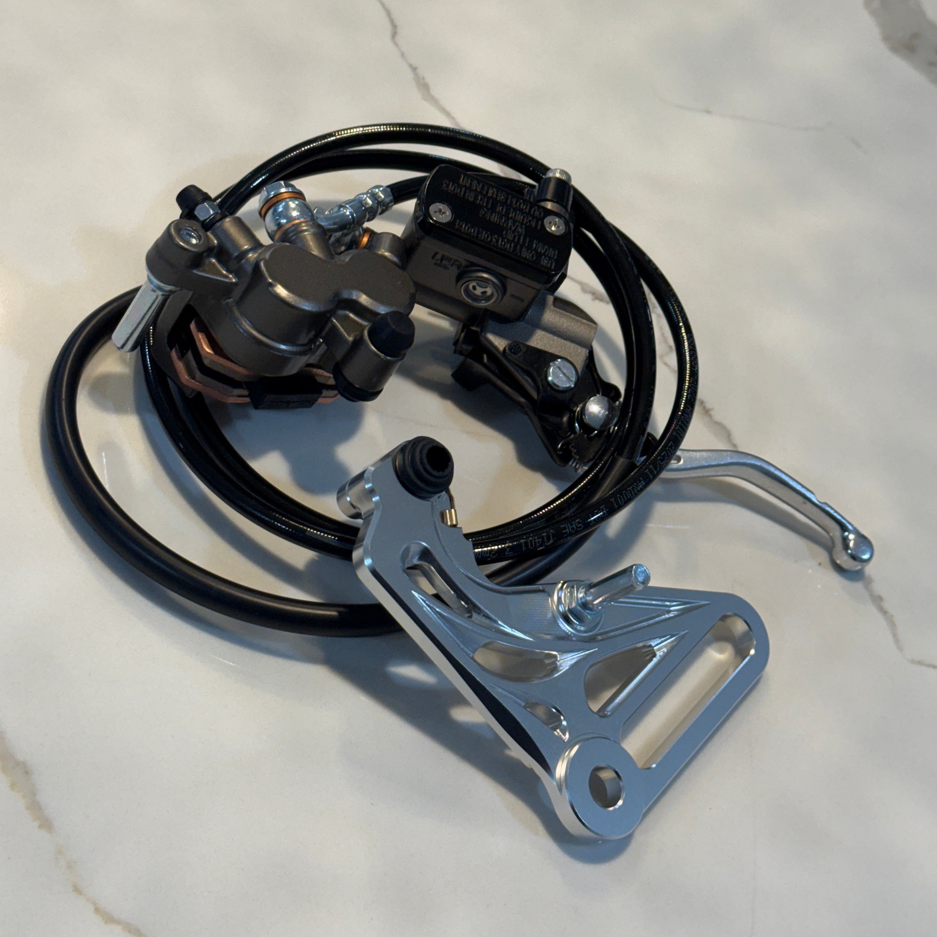Mechanical brake system on a white marble surface