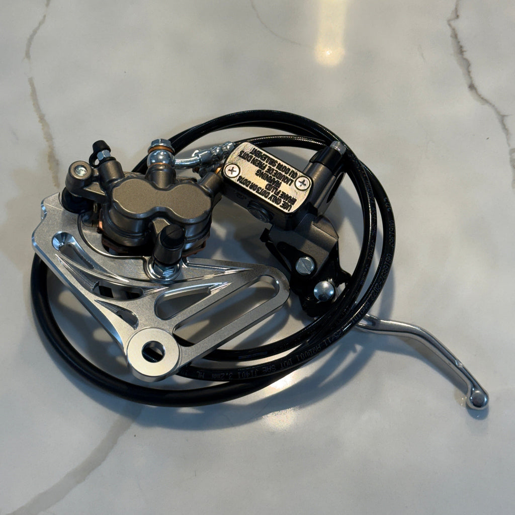 Mechanical brake component on a gray surface
