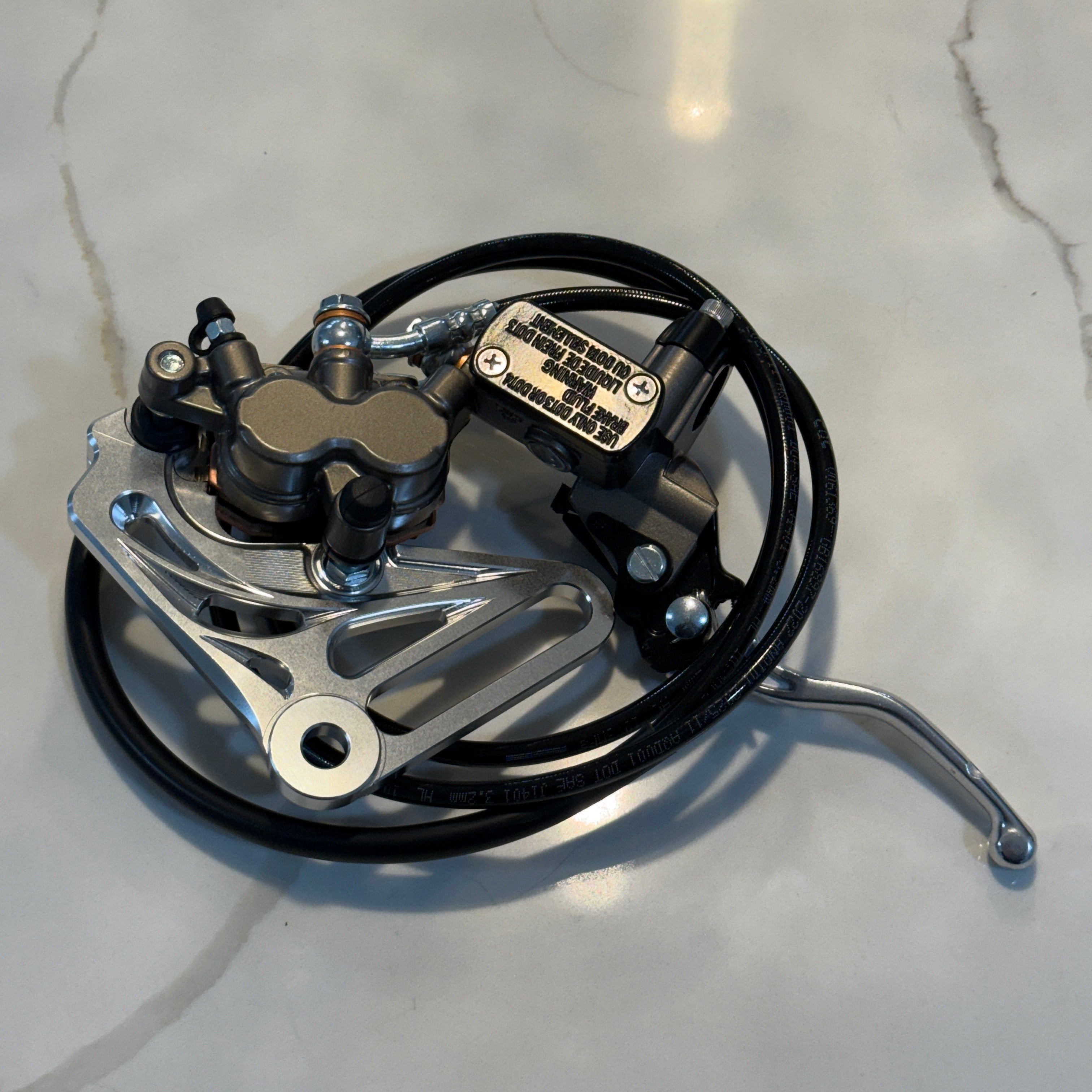 Mechanical brake component on a gray surface