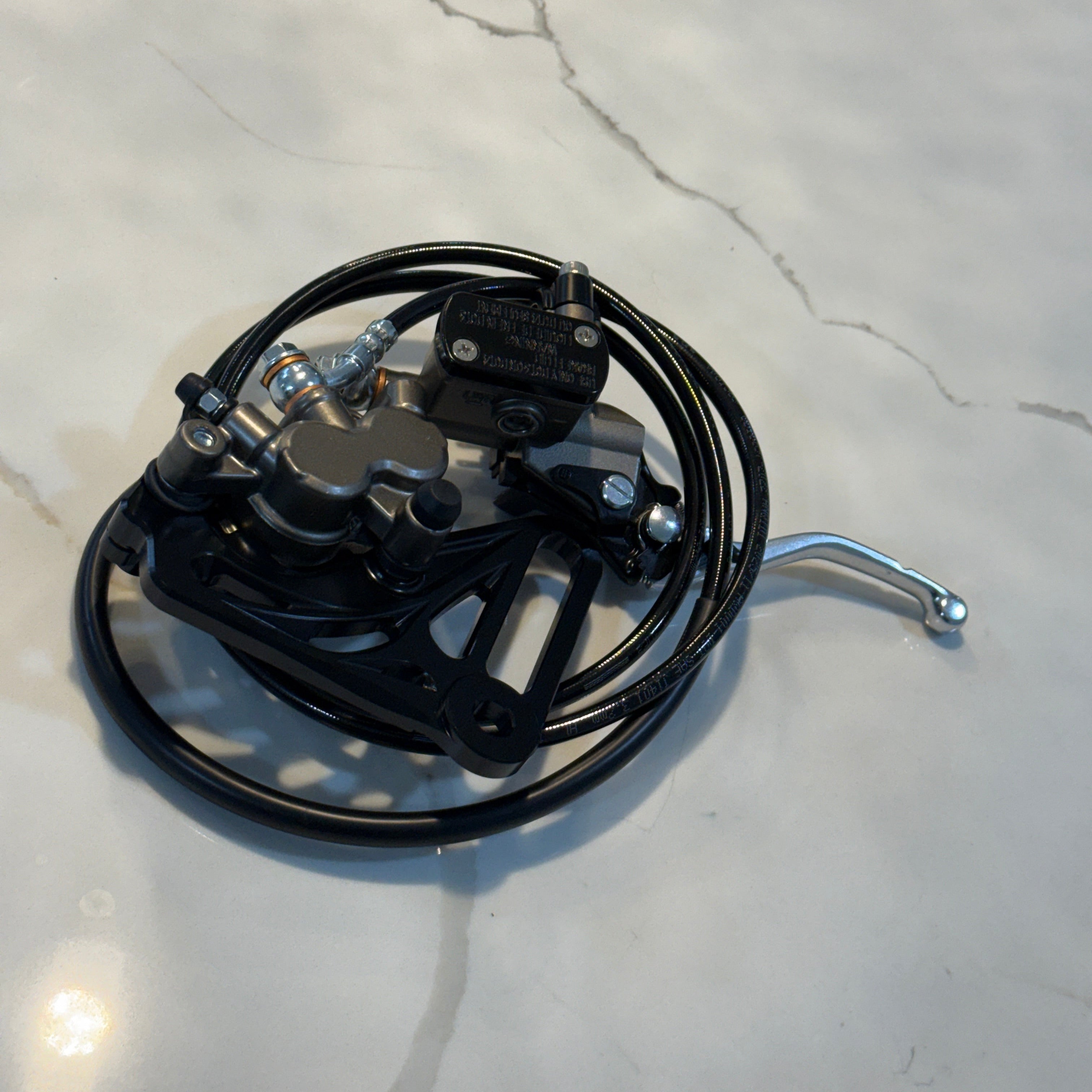 Mechanical wiring harness on a light-colored marble surface