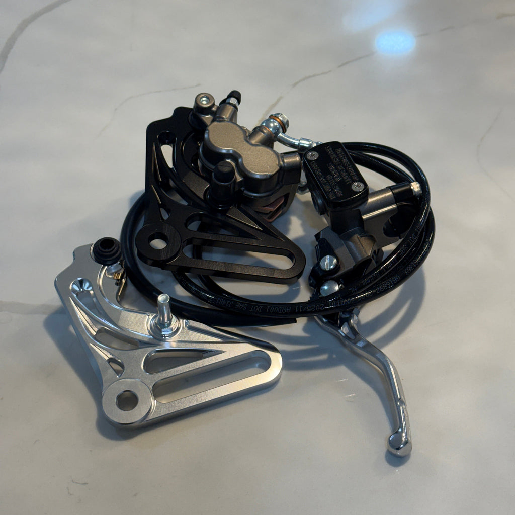 Bicycle brake mechanism on a light gray surface