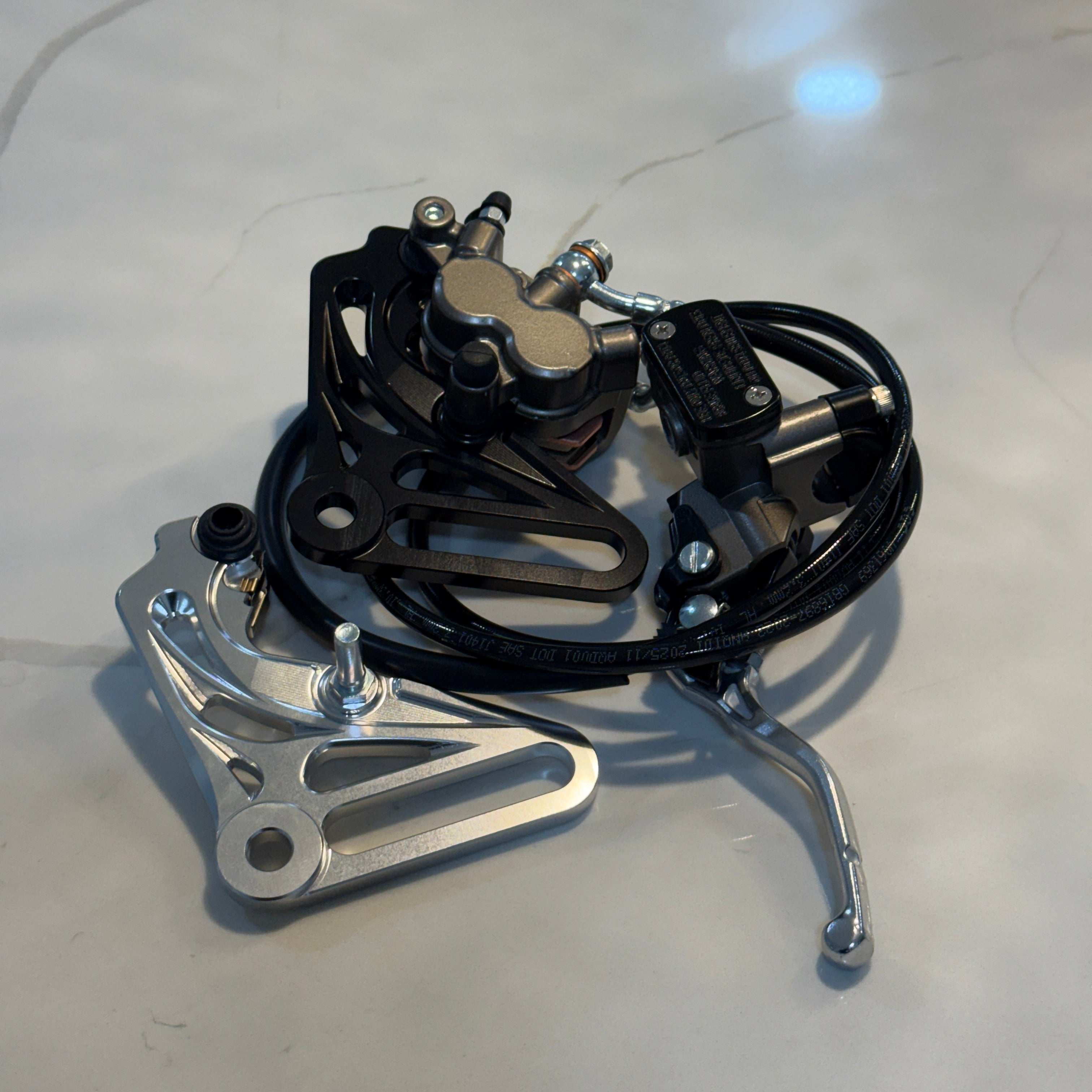 Bicycle brake mechanism on a light gray surface