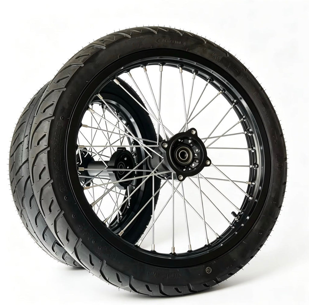 Motorcycle wheel with black tire on a white background