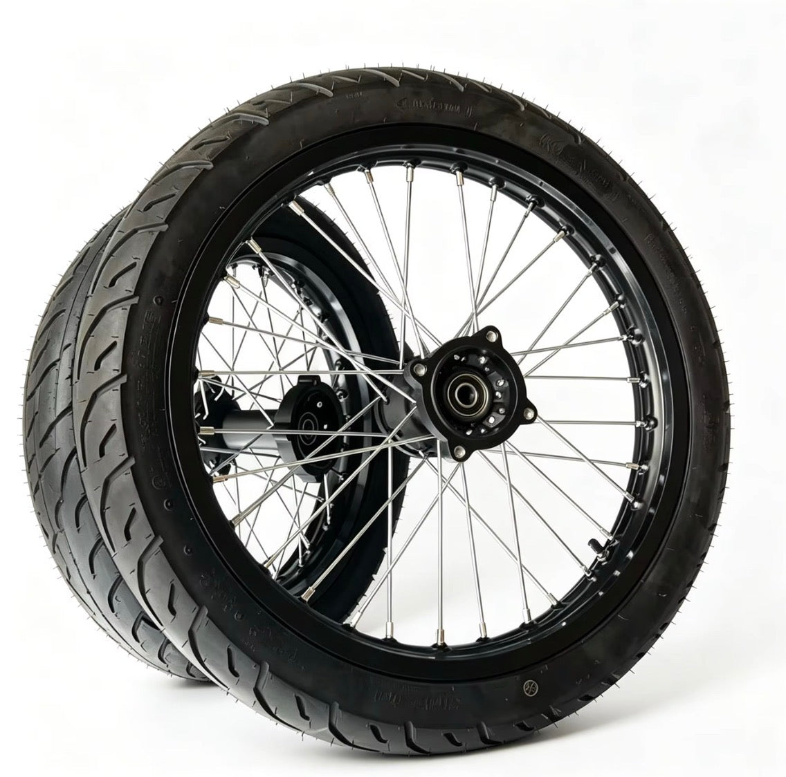 Motorcycle wheel with black tire on a white background